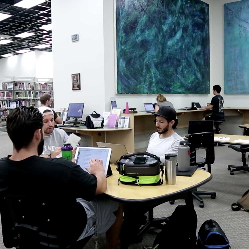Students studying in the Life West Library