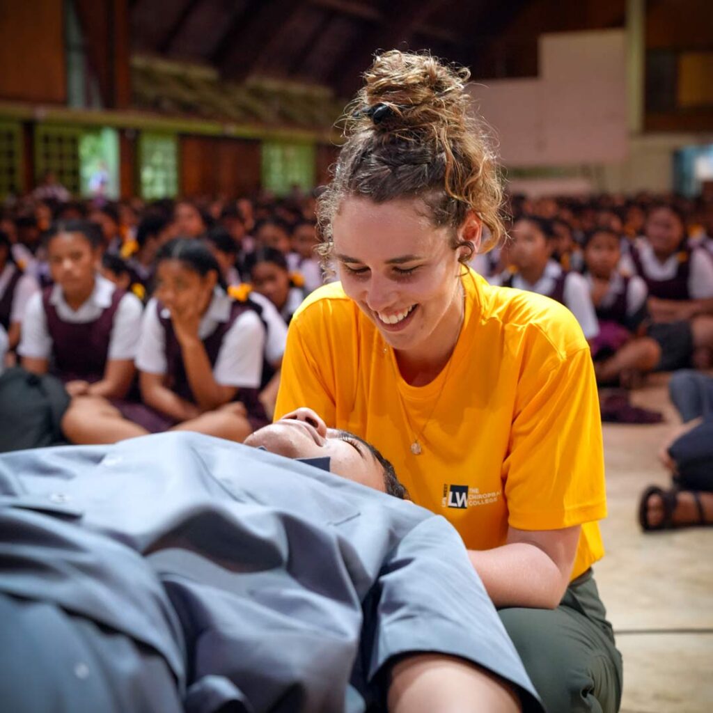 Life West Chiropractic Student adjusting a patient during a Tonga Service Trip