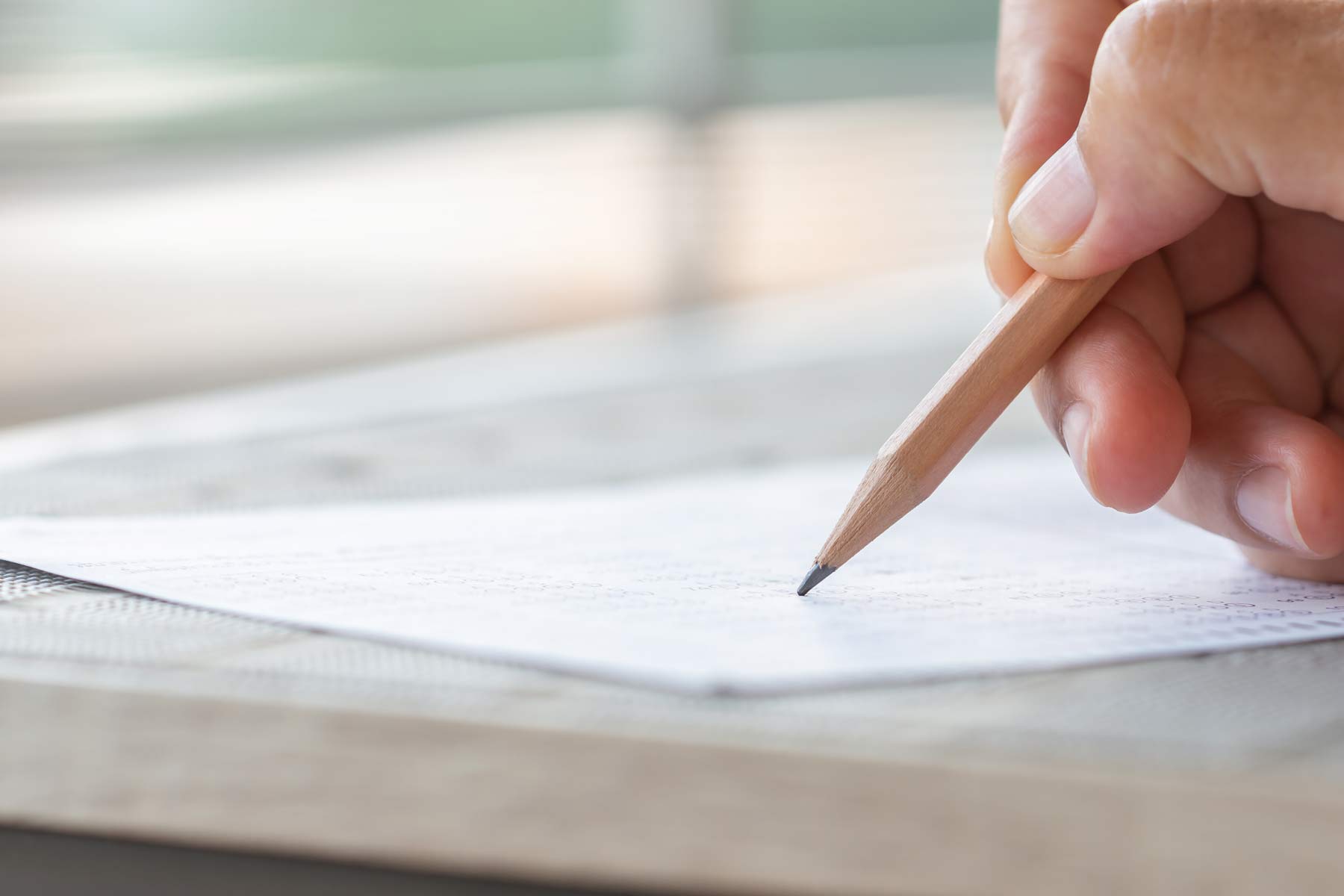 Student taking multiple choice exam representing the NBCE chiropractic board exam