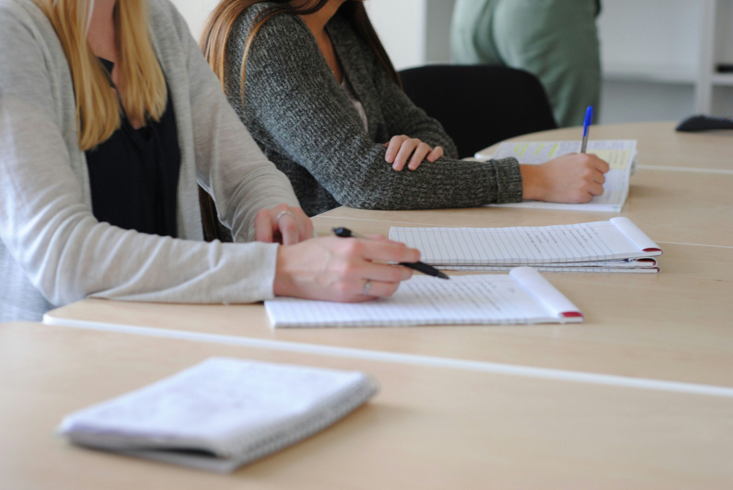 Taking notes at a meeting representing Life Chiropractic College West's College Advisory Council